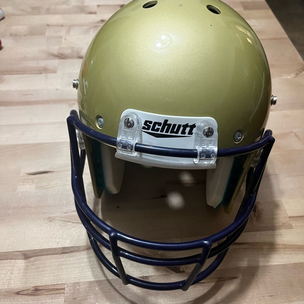 Schutt Gold Football Helmet with Purple Faceguard
